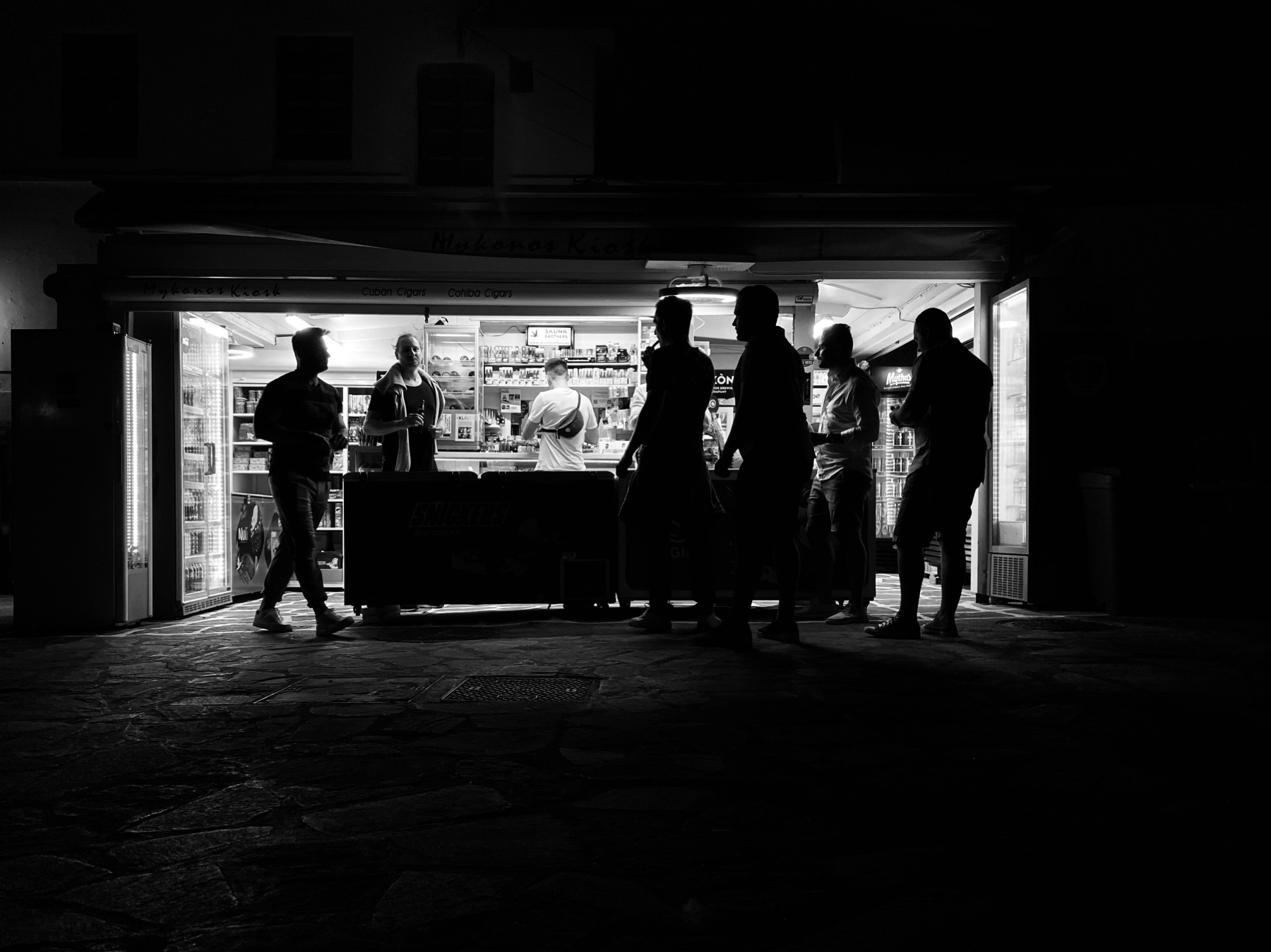 Black and white street scene in an underpass