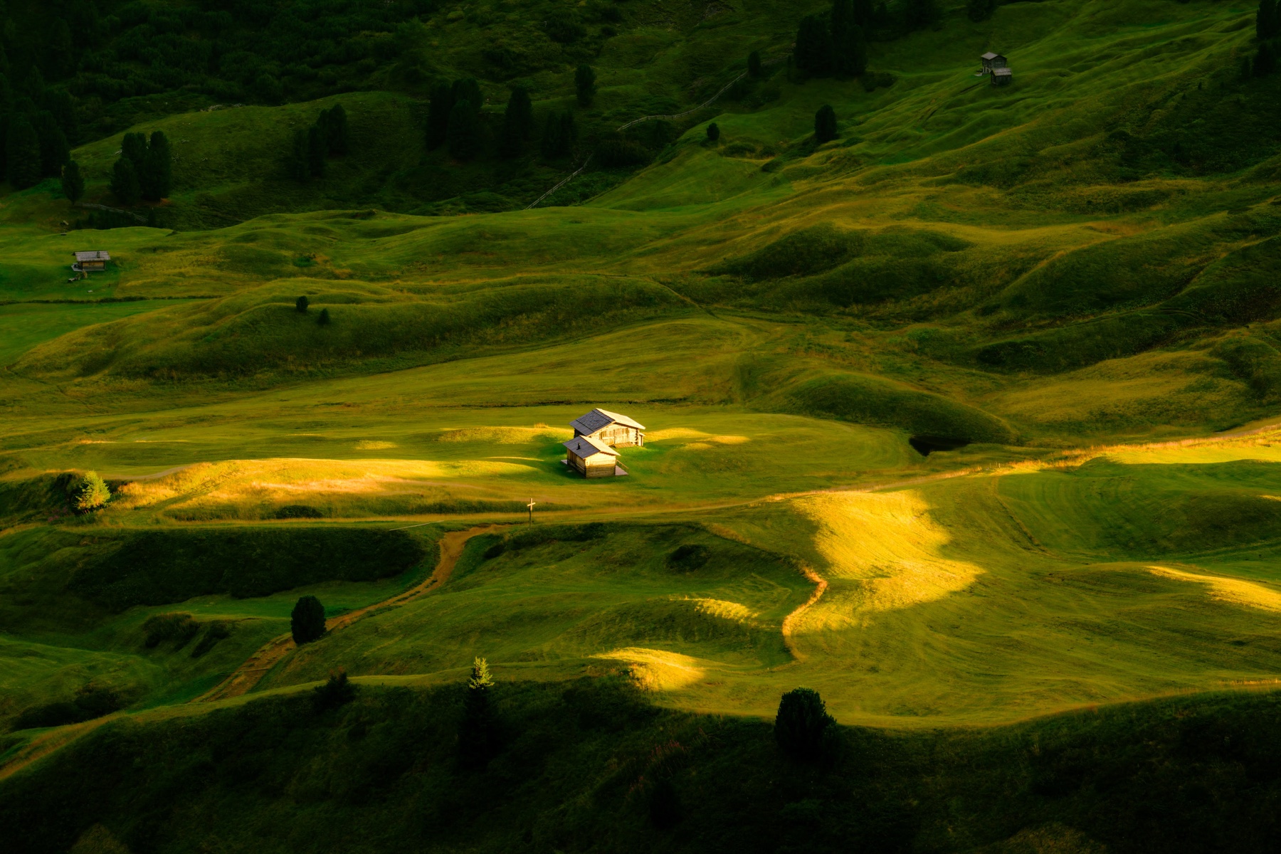Dark mountain scene shaped by light